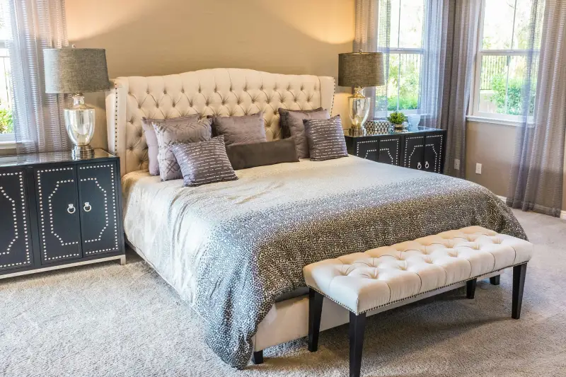 Calm bedroom with freshly painted walls and headboard